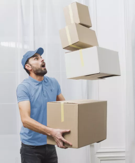 Mover holding stacked cardboard boxes